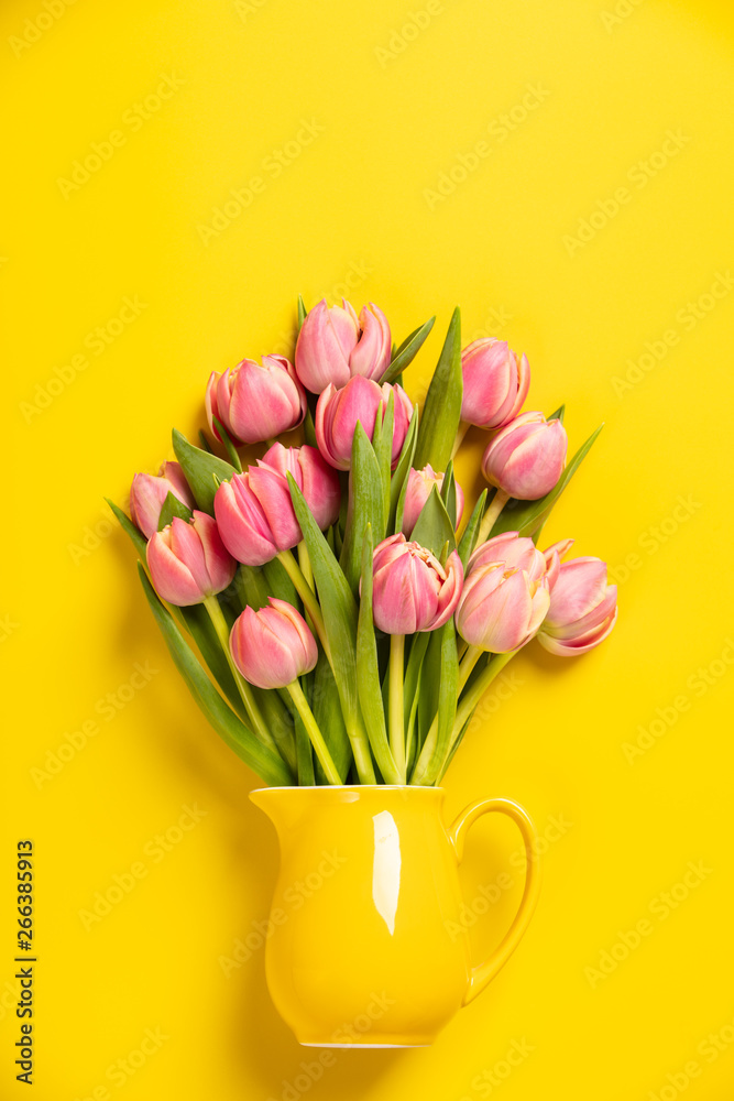 Fresh pink tulips in a jug, close up