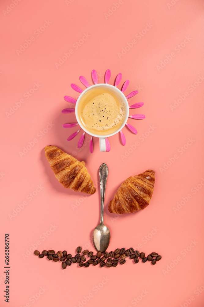 Creative layout made of coffee cup, croissants, coffee beans and