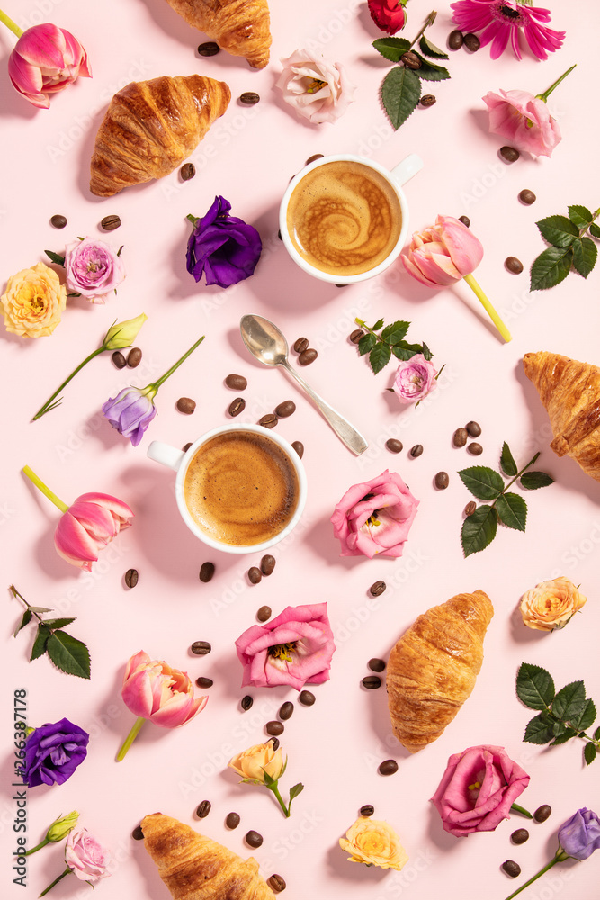 Morning coffee, croissants and a beautiful flowers . Flat lay st