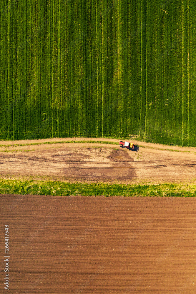 Aerial view of tractor with attached crop sprayer