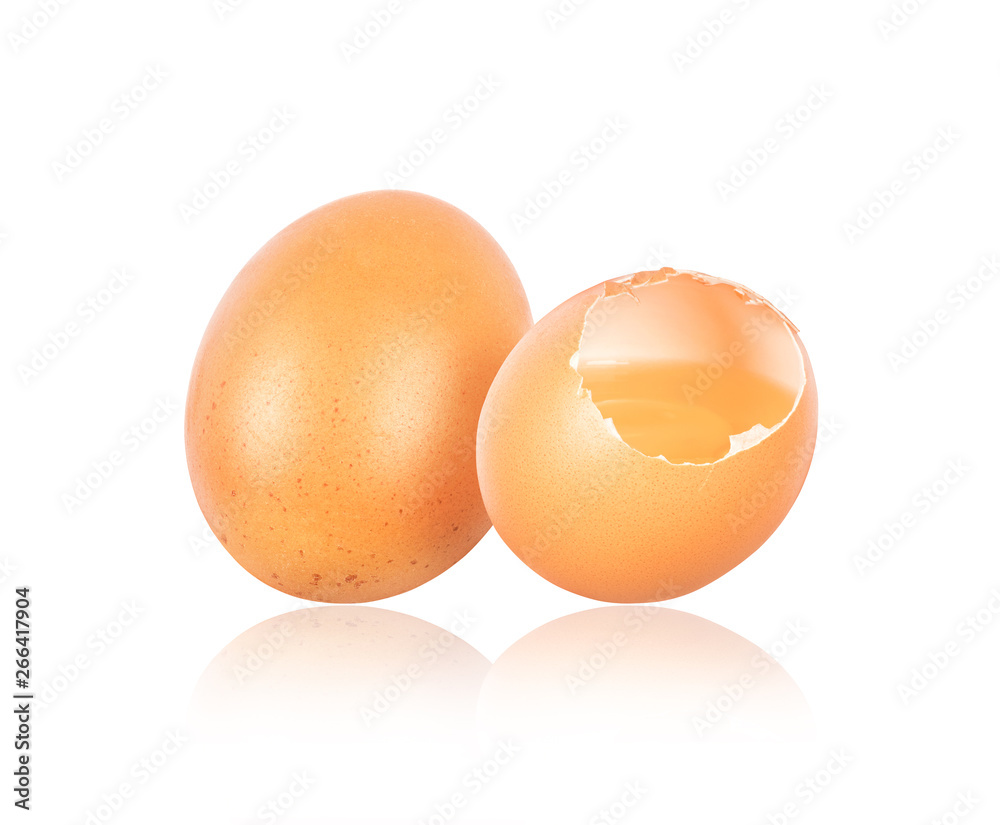 Whole and broken eggs close-up isolated on white background