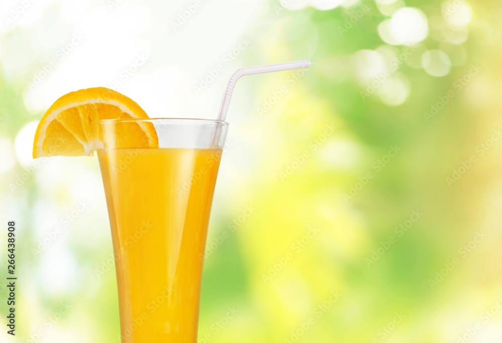 Orange juice glass on background