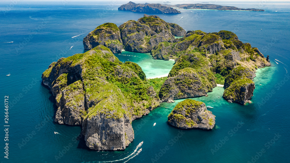 Aerial drone view of tropical Ko Phi Phi island, beaches and boats in blue clear Andaman sea water f