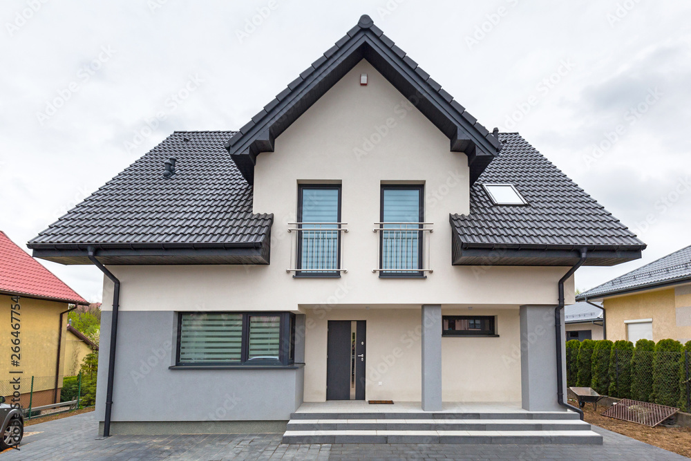 House with new laid concrete paver blocks