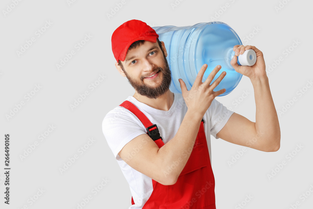 Delivery courier with bottle of water on white background