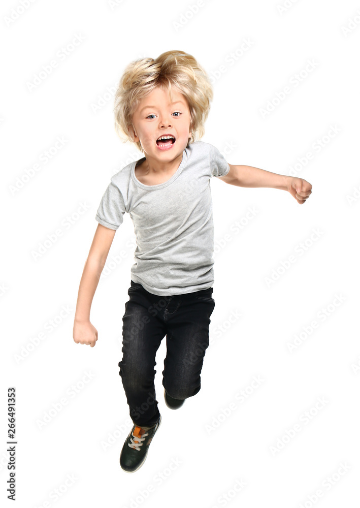 Jumping little boy on white background