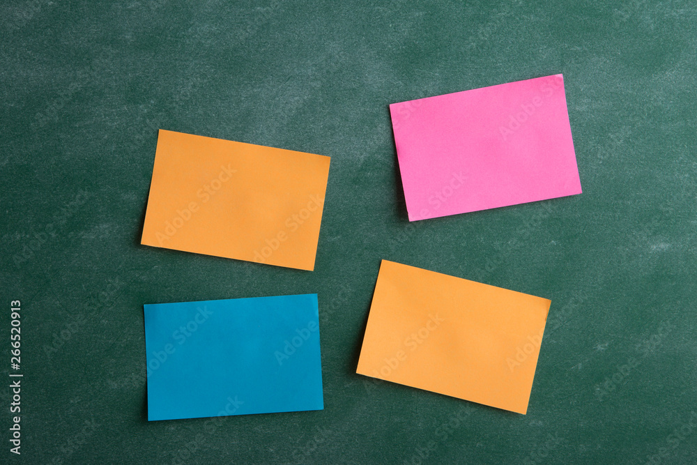 Colorful sticky notes on the blank blackboard