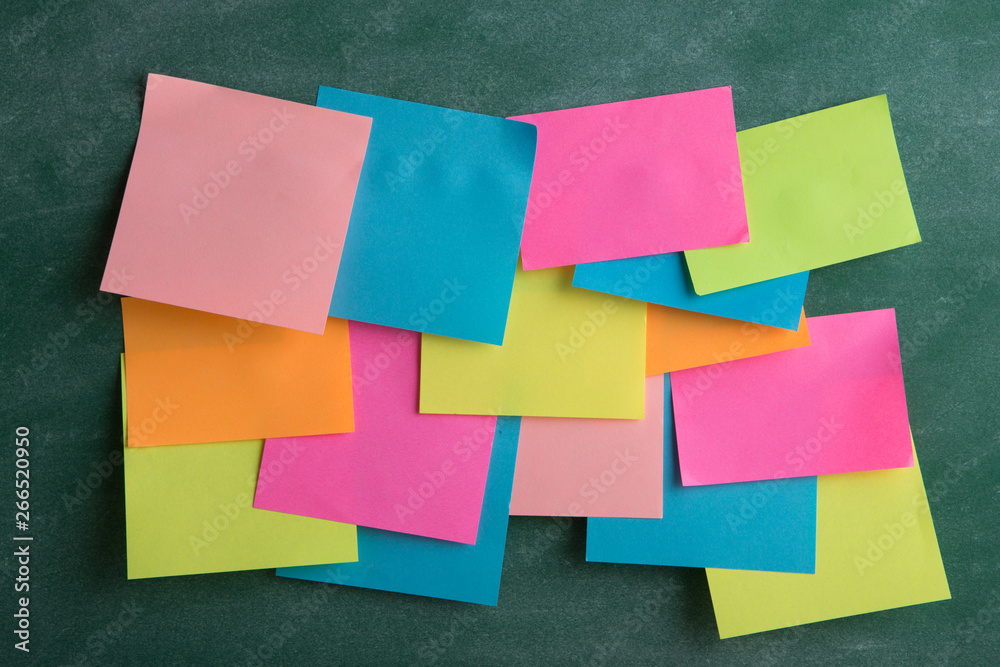 Colorful sticky notes on the blank blackboard