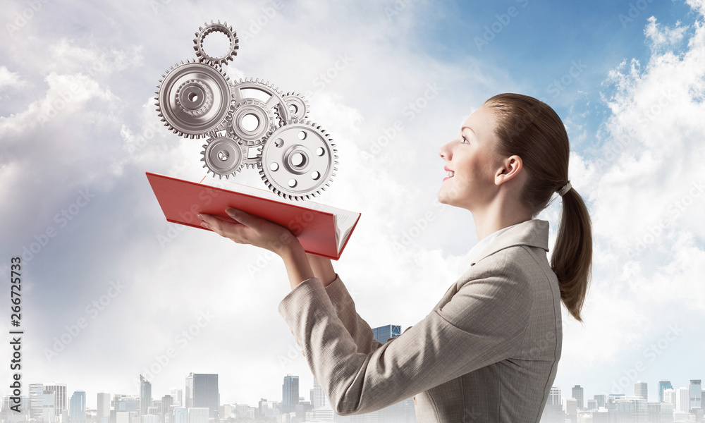 Woman holding open notebook with mechanism