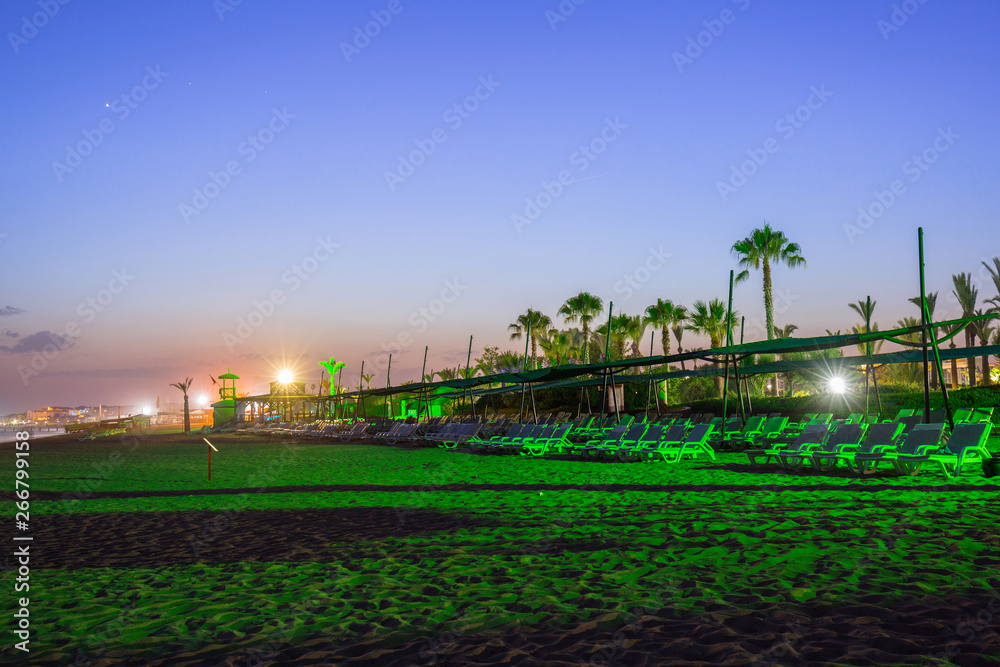 Beach scenery with palm trees at night, Turkey