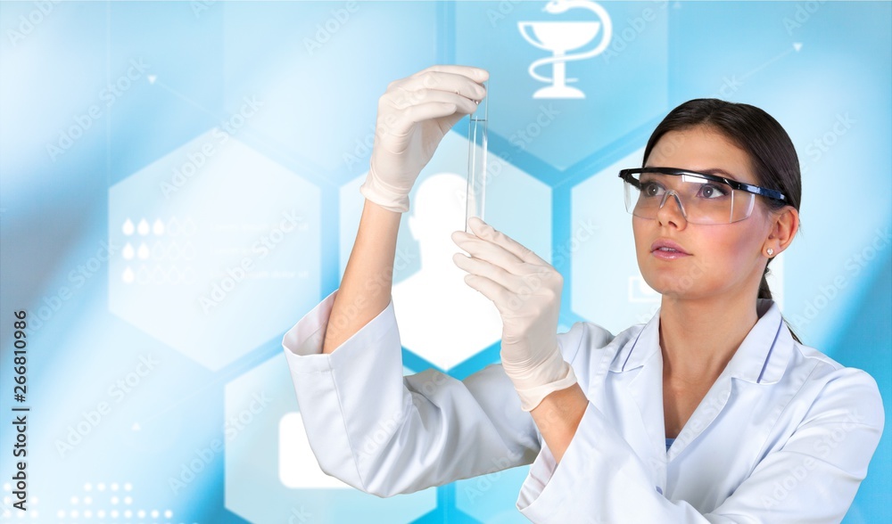 Young female scientist standing in her lab.