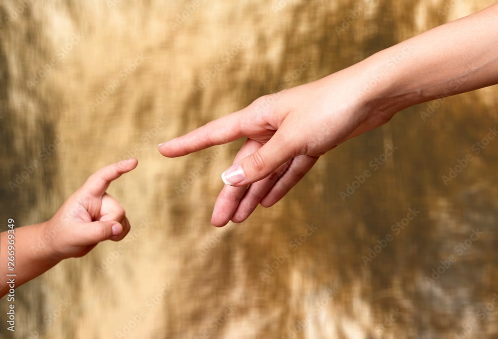 Child and adult human hands isolated on white