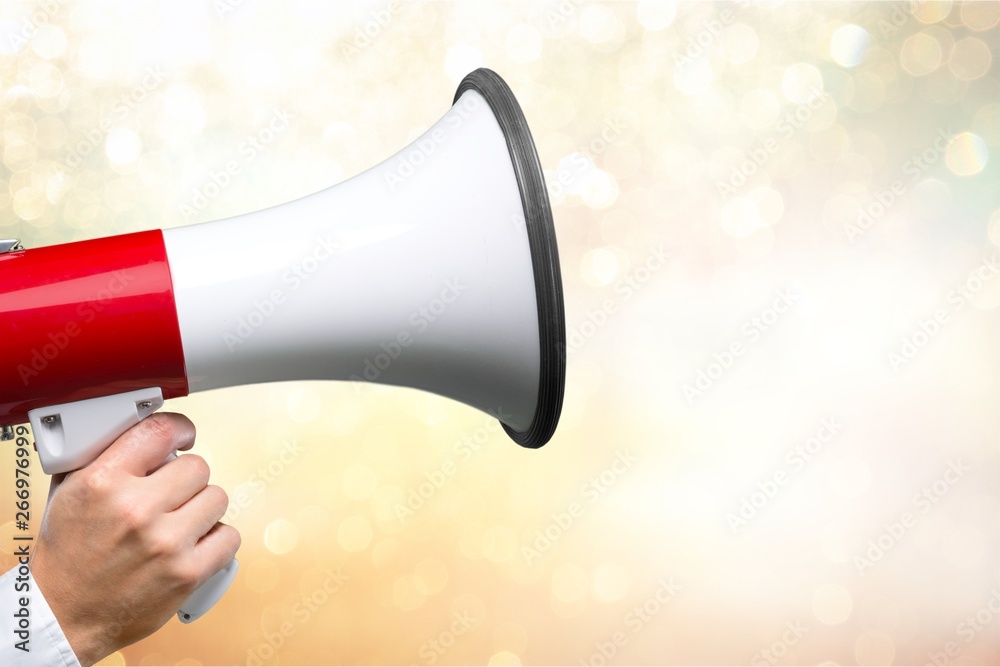 Close-up Human Hand with Megaphone on  background