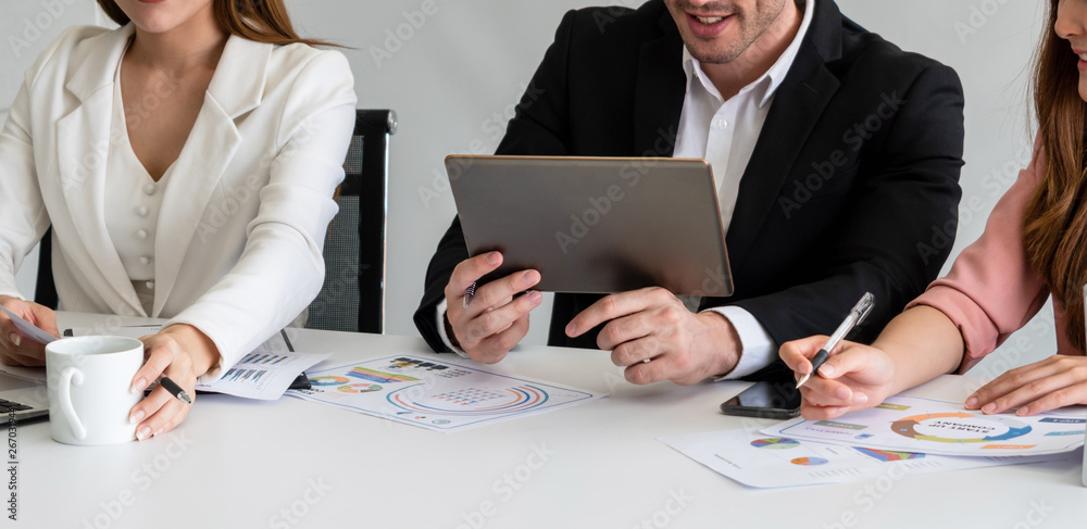 Businessman is in meeting discussion with colleague businesswomen in modern workplace office. People