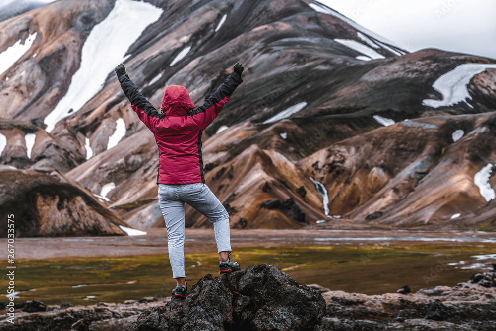 Traveler hiking at Landmannalaugar surreal nature landscape in highland of Iceland, Nordic, Europe. 