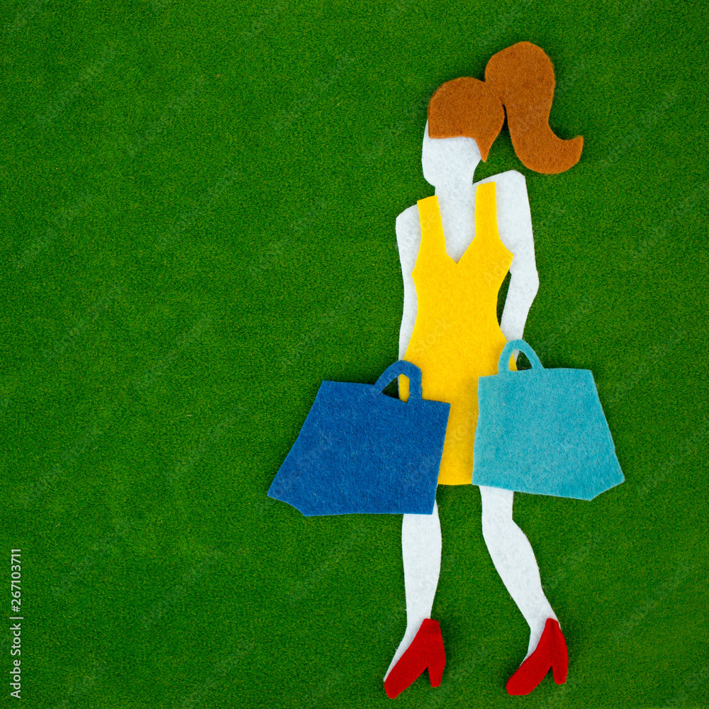 Female legs with shopping bags over bright background