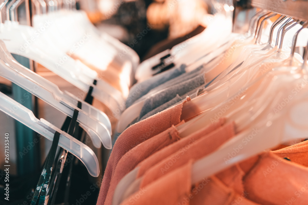 Casual Clothes And Shirts Hanged On Fashion Store Hanger