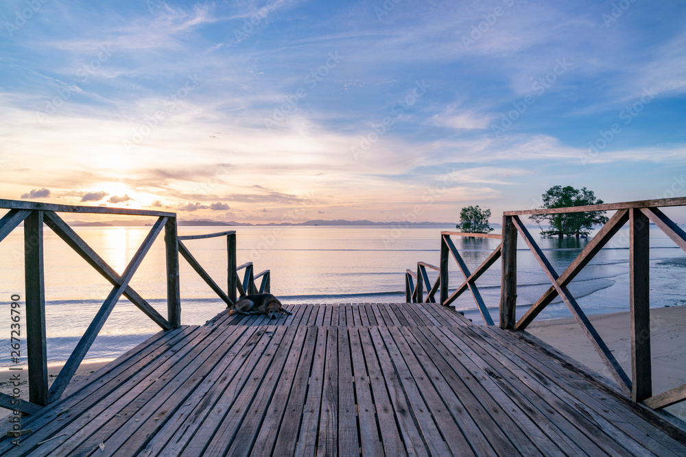 Wooden porch by the sea in sunrise beautiful light of nature