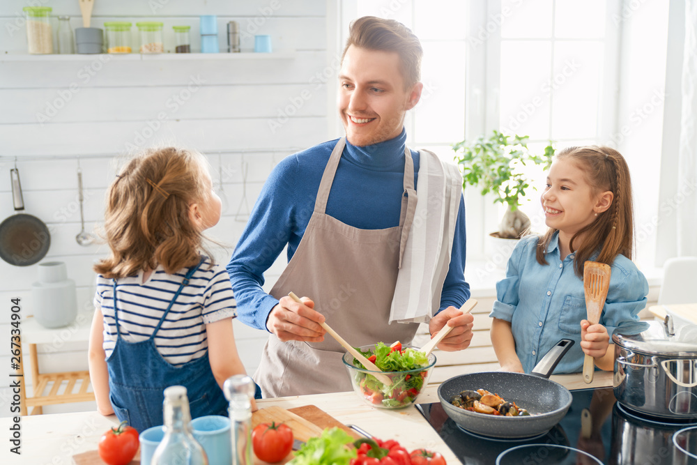 Happy family in the kitchen.