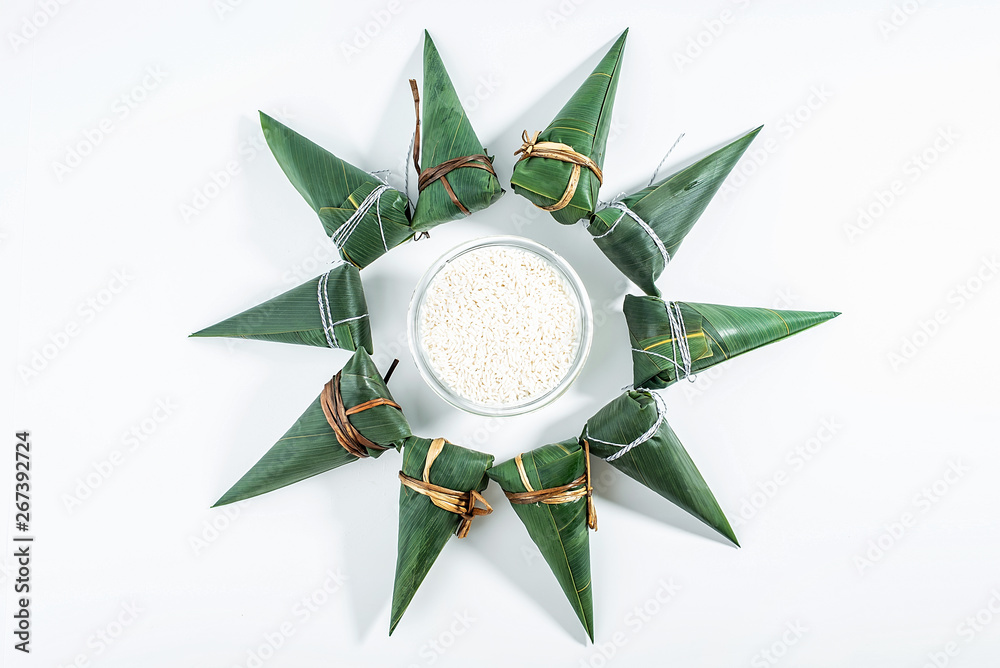 Fresh wrapped hazelnuts and white glutinous rice on white background