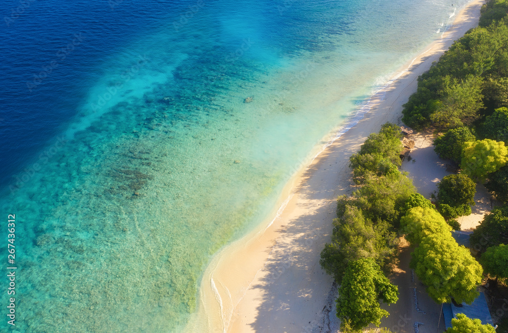 Sea coast as a background from top view. Turquoise water background from top view. Summer seascape f