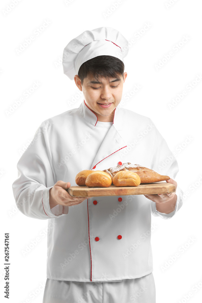 Asian chef with fresh bakery products on white background