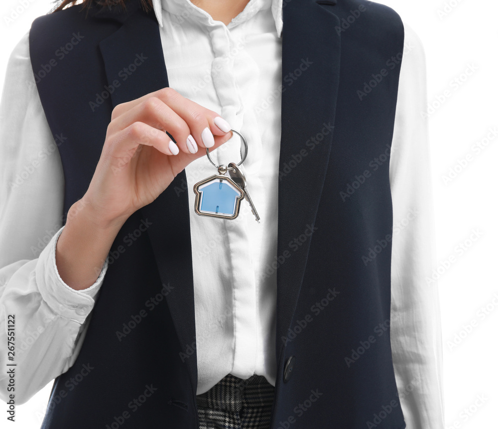 Female real estate agent with key on white background, closeup