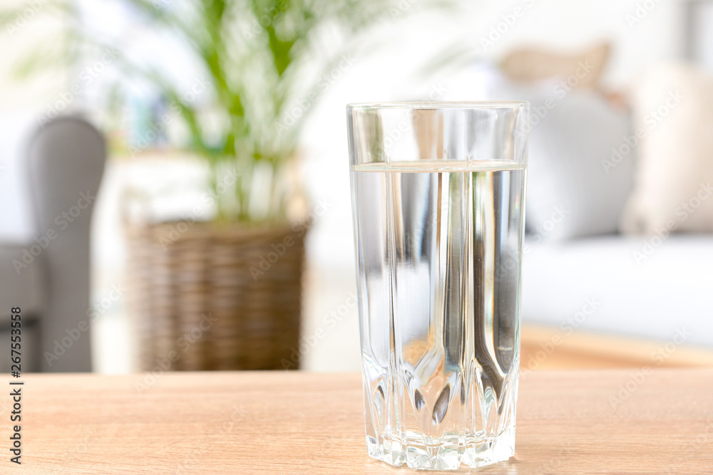 Glass of fresh water on table