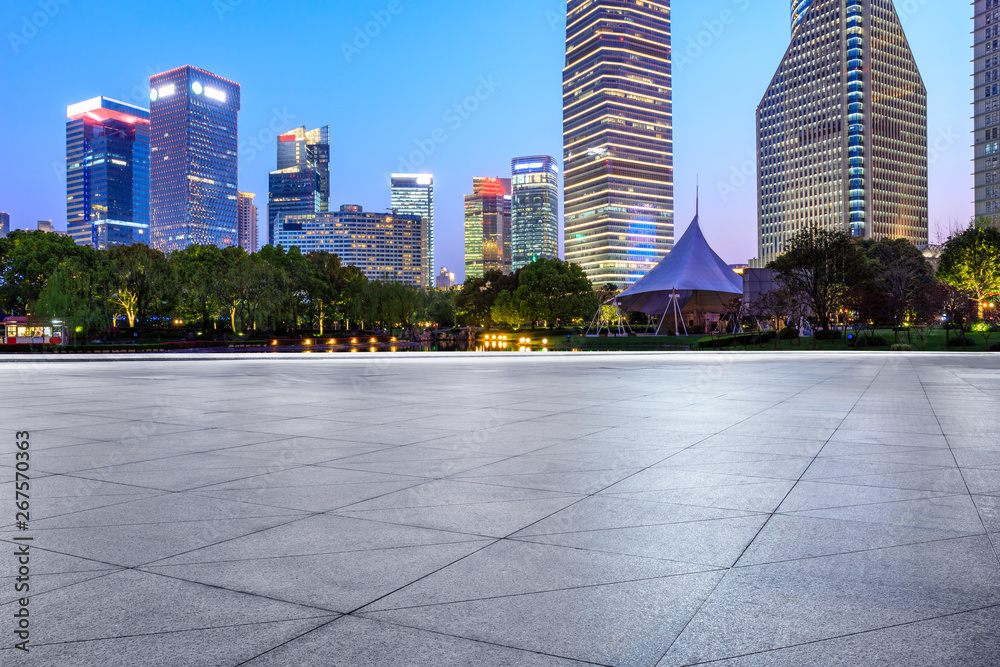 Shanghai modern commercial office buildings and square floor at night