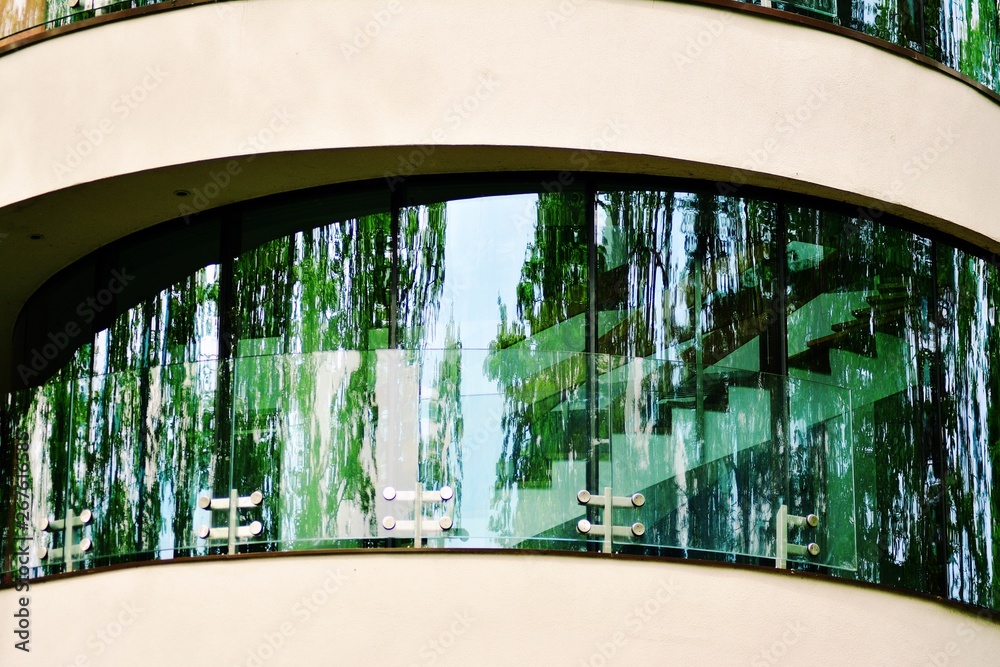 Abstract image of looking up at modern glass and concrete building. Architectural exterior detail of