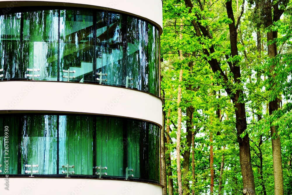 Abstract image of looking up at modern glass and concrete building. Architectural exterior detail of