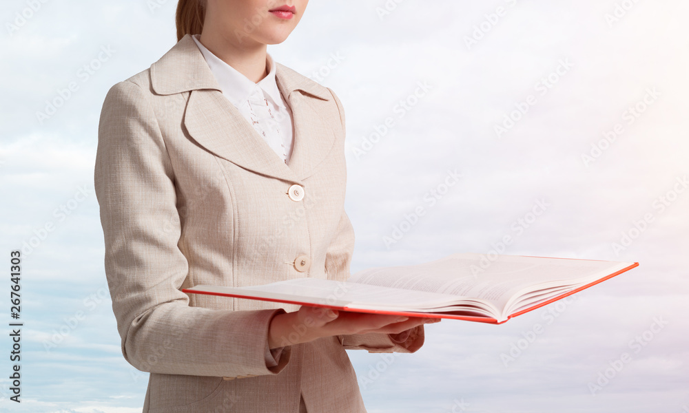 Business woman holding open notebook