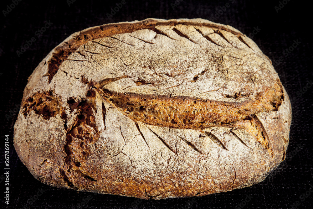 Loafs (or miche) of French sourdough, called as well as Pain de campagne, on display isolated on a b