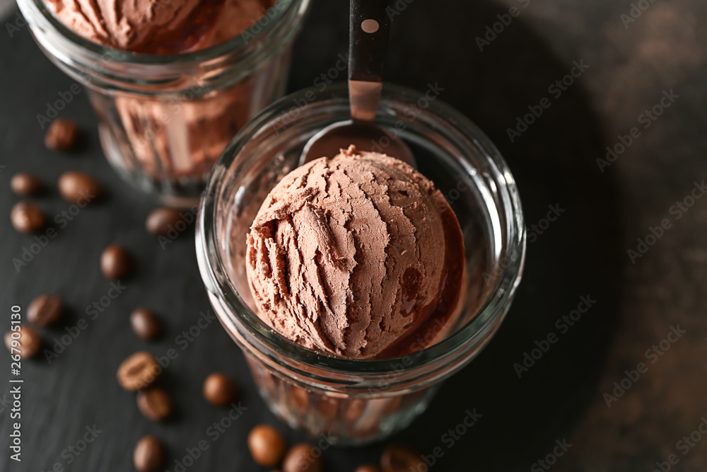 Glasses with tasty chocolate ice cream on dark background, closeup