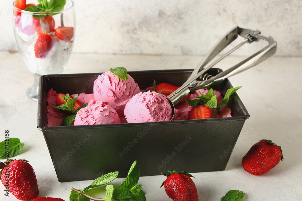 Box with tasty strawberry ice cream on table