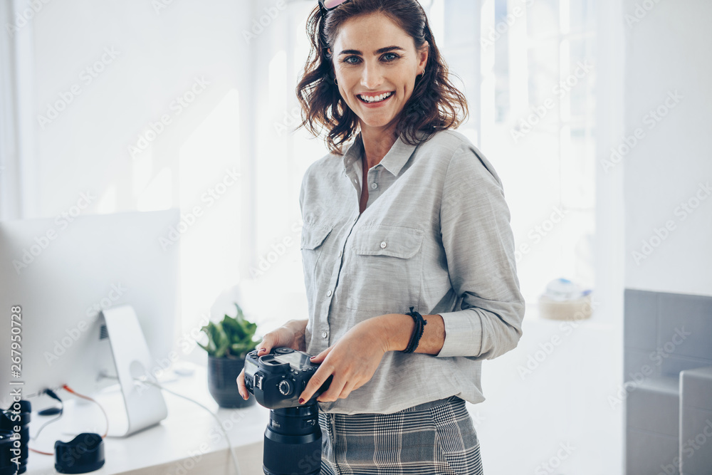 Confident female photographer