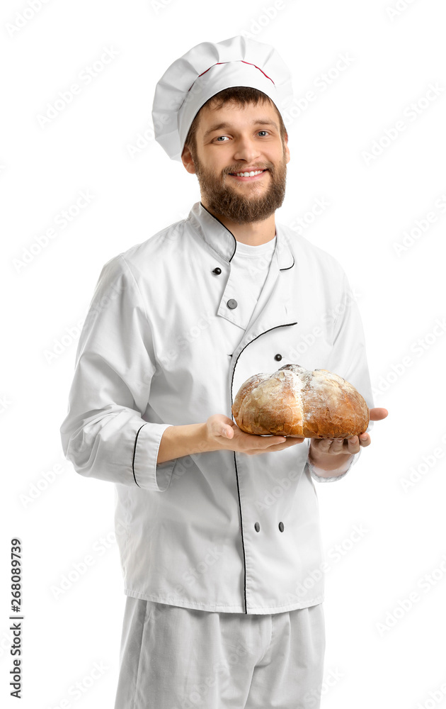 Young baker with fresh bread on white background