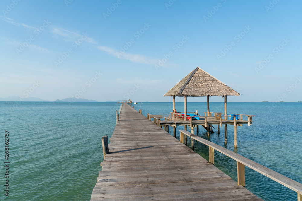 Wooden pier with boat in Phuket, Thailand. Summer, Travel, Vacation and Holiday concept.