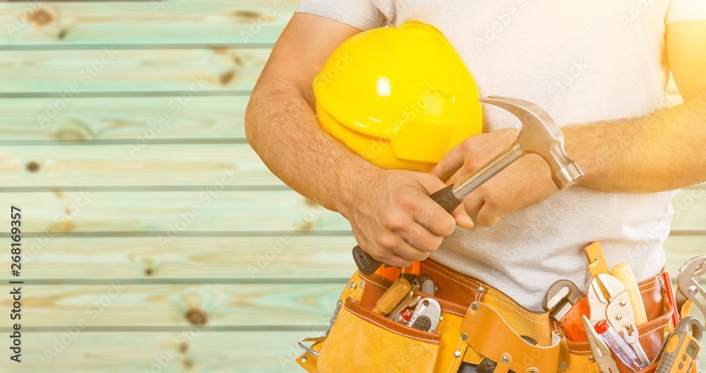 Worker with a tool belt. Isolated over  background.