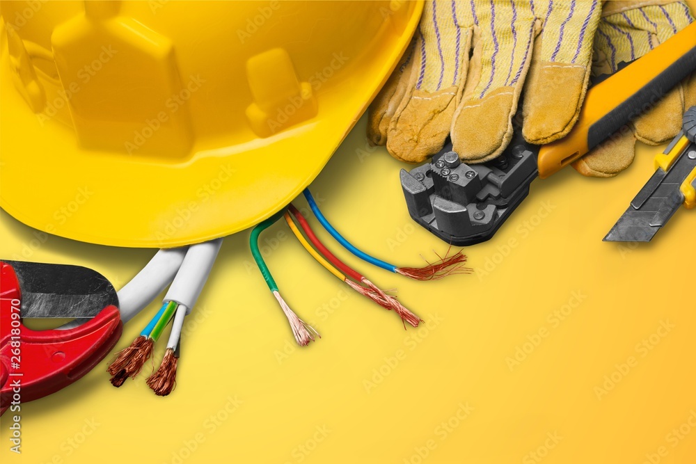 Yellow hard hat and leather work gloves