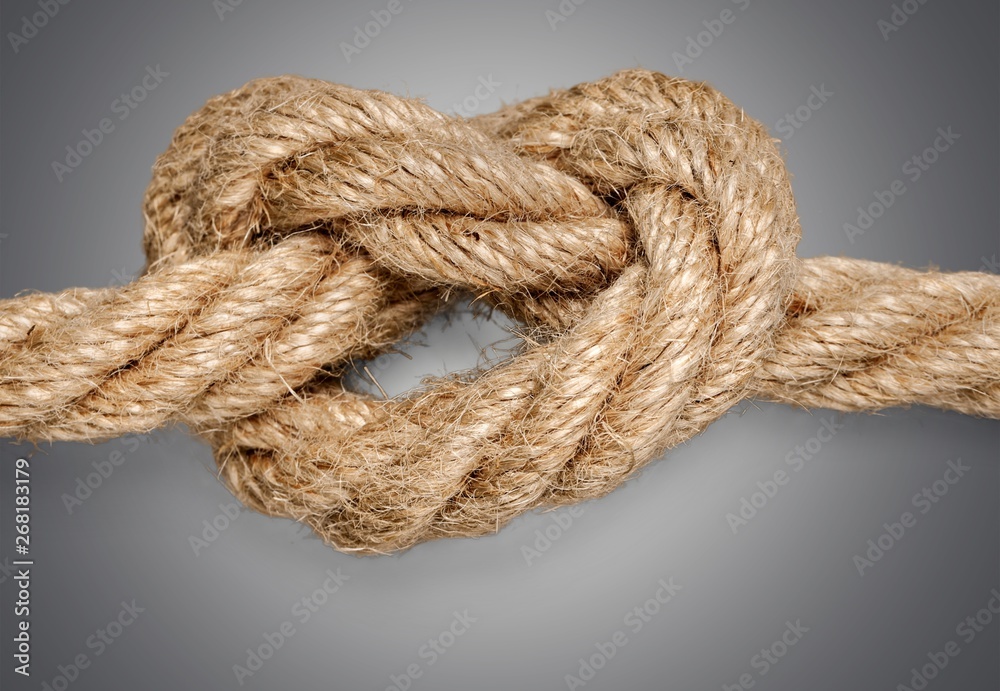 Knot on a cord close up on  background