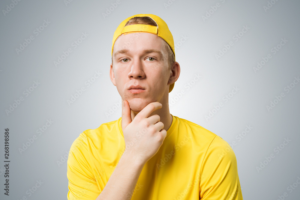 Teenager having serious and calm face.