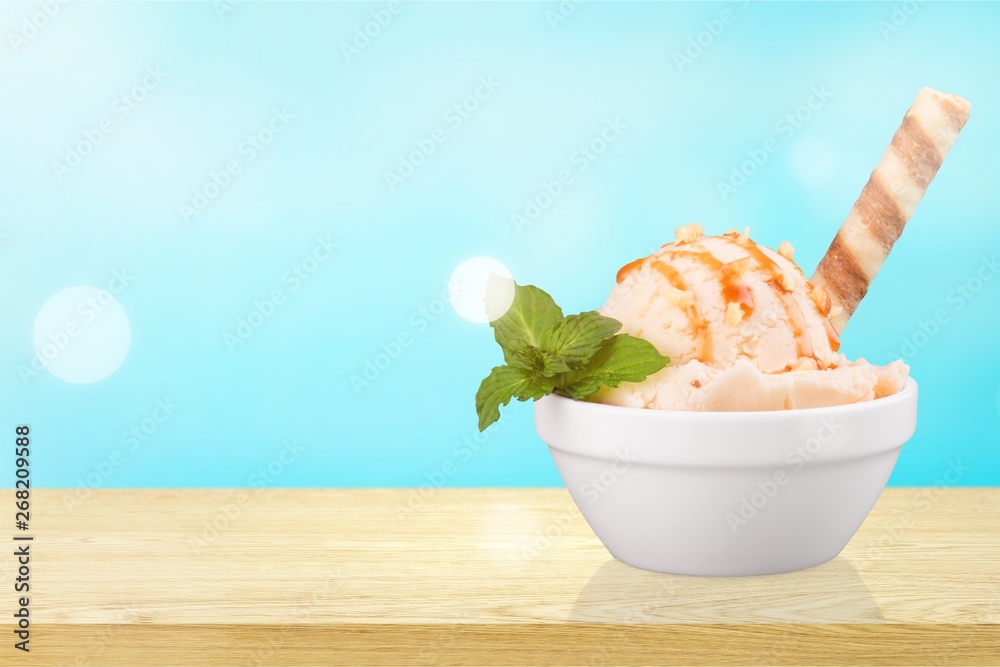 Berry ice cream in glass bowl on white background