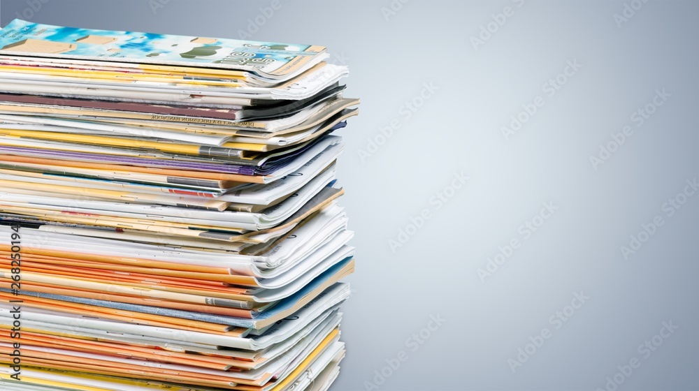 Pile of newspapers on white background