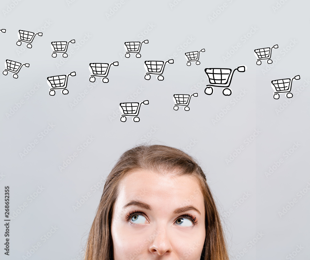 Online shopping with young woman looking upwards