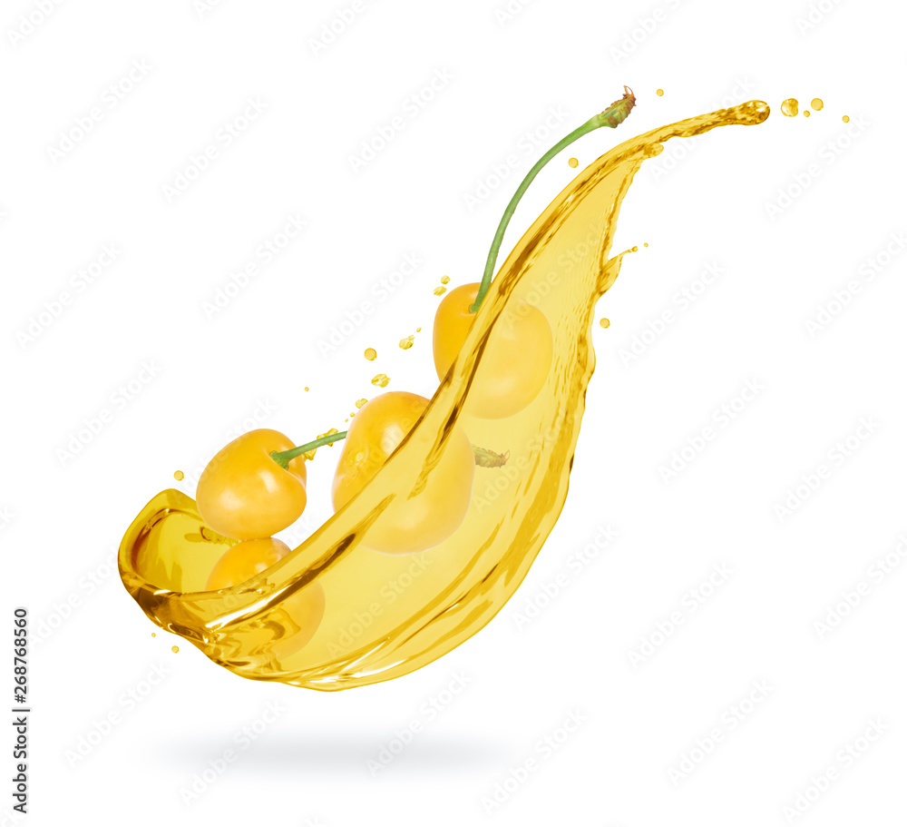 Yellow cherries with splashes of fresh juice close-up on white background