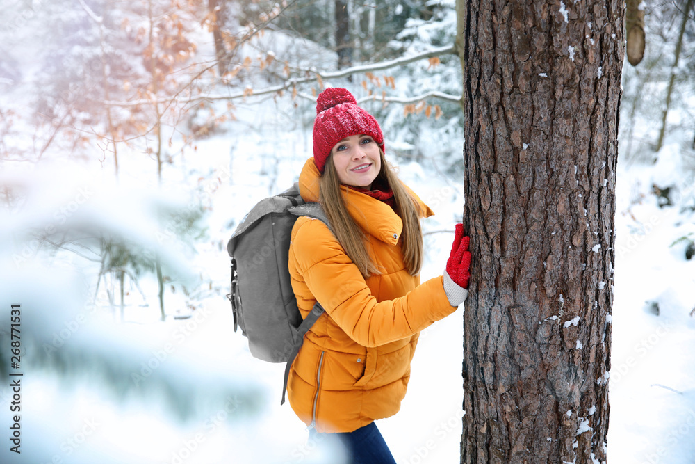 Beautiful woman in winter forest