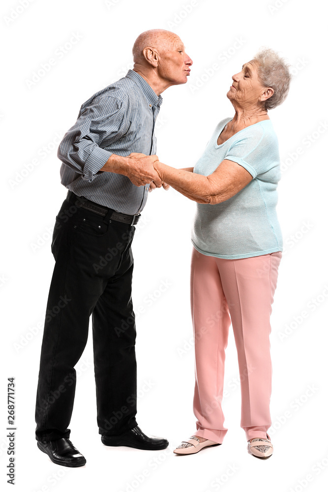 Portrait of senior couple on white background