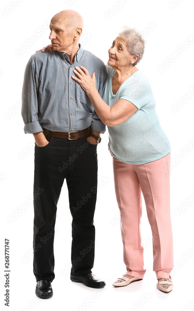 Senior woman and her offended husband on white background