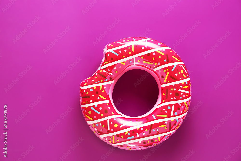 Inflatable ring on color background